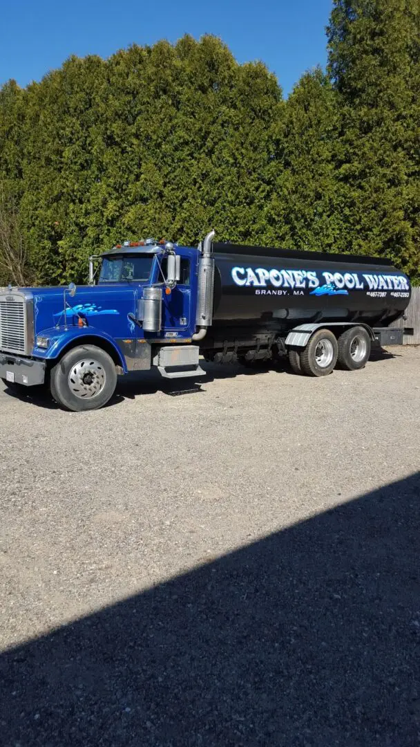 A blue truck with a black tank on the side.