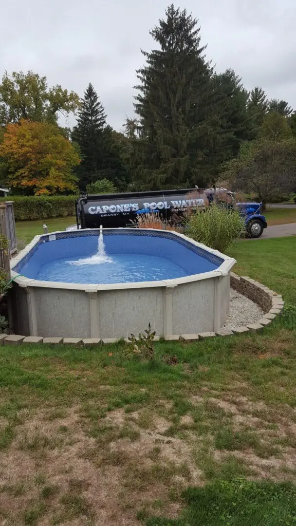 A pool with water coming out of the bottom.