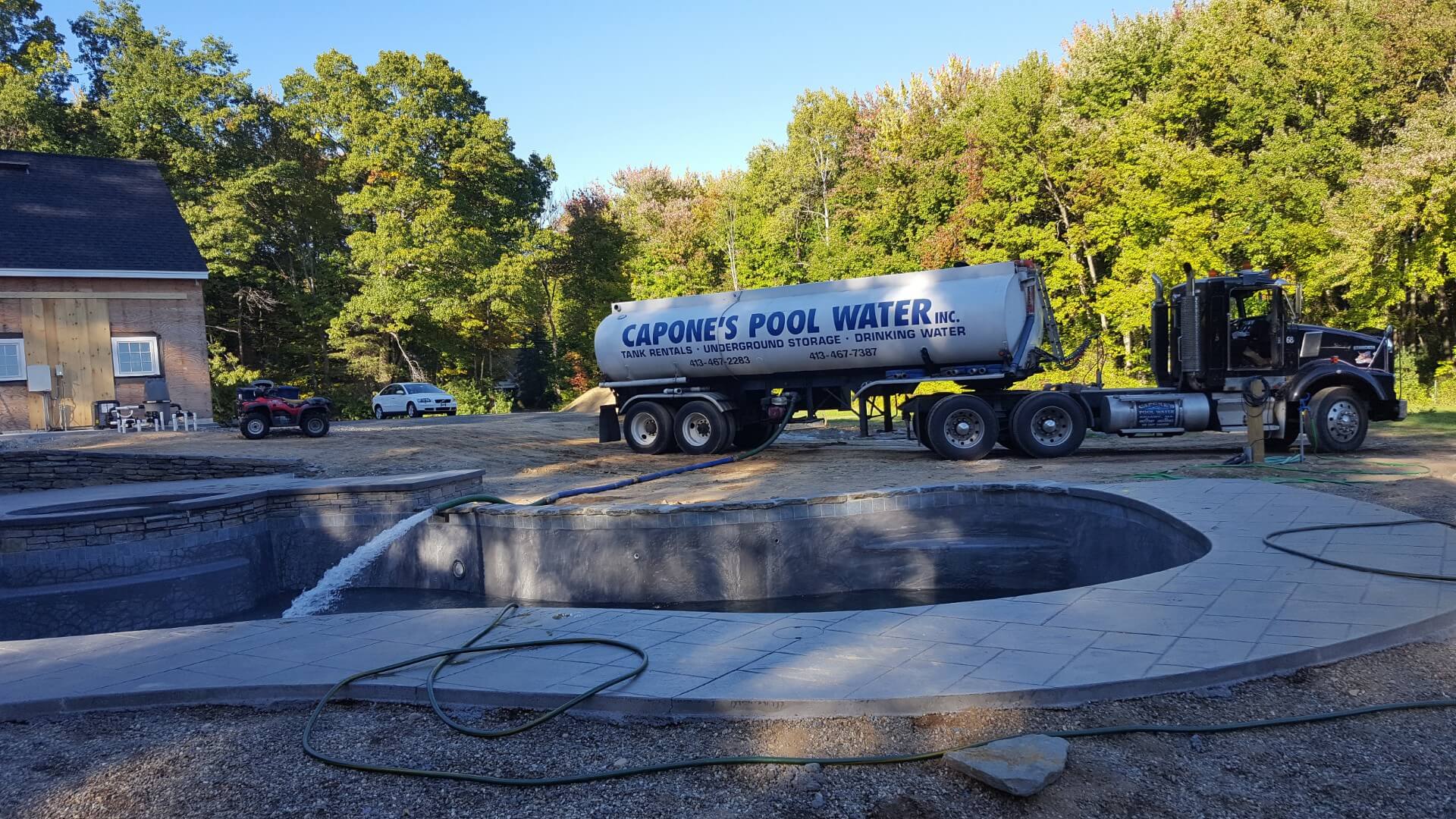 A large truck is parked in the middle of a pool.